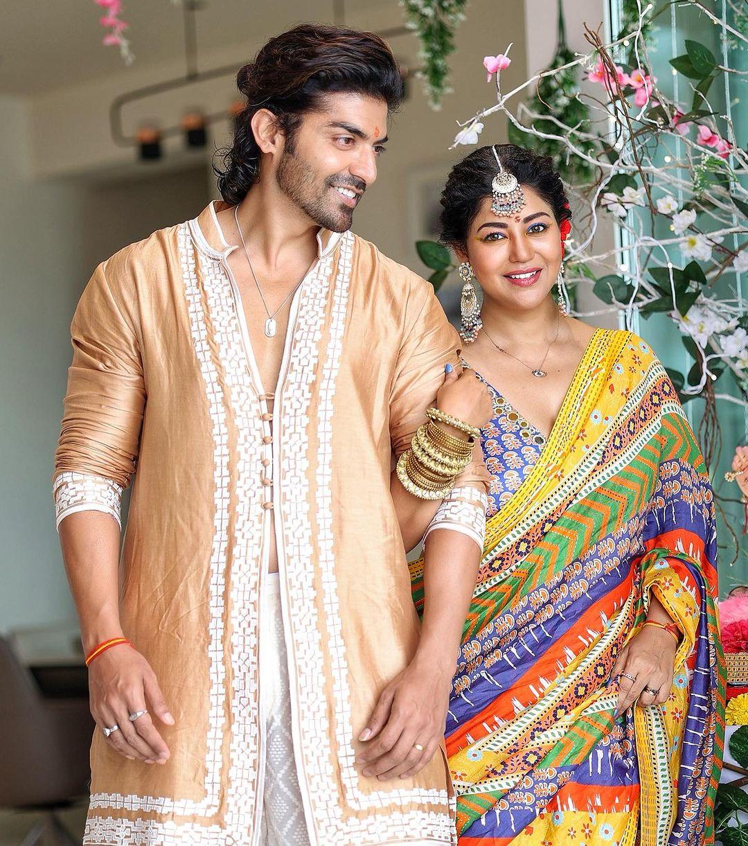 Debina Bonnerjee donned a vibrant, multi-colored saree that added a burst of colors to the festivities.